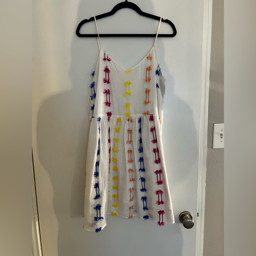 Off white linen material dress with colorful details.